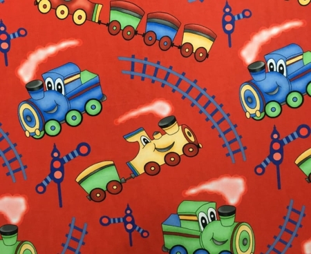 Kolorowa tkanina dziecięca BAJKA 11 Wesoła Kolejka z motywem uśmiechniętych pociągów na czerwonym tle.jpg